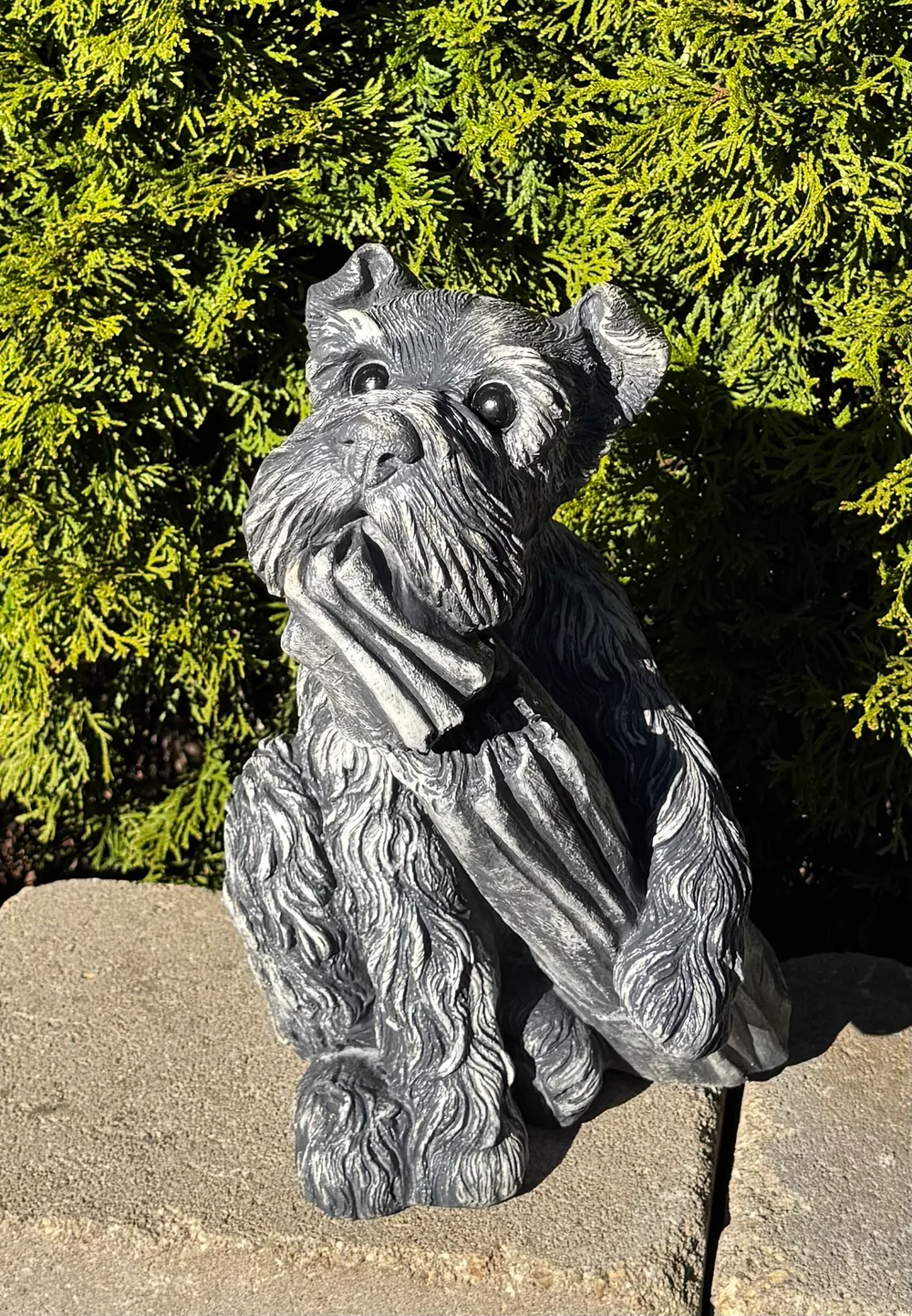 Dog Chewing on News Paper Garden Statue